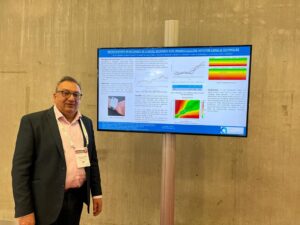 Afon Technology visit ATTD Berlin 2023 Dr Sabih Chaudhry at ATTD Berlin standing next to a tv screen.